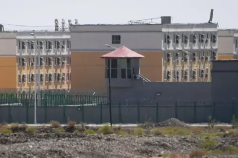 Getty Images This photo taken on June 2, 2019, shows buildings at the Artux City Vocational Skills Education Training Service Center, believed to be a re-education camp where mostly Muslim ethnic minorities are detained, north of Kashgar in China's north-western Xinjiang region.