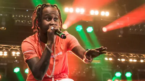 Getty Images Popcaan performing in 2017