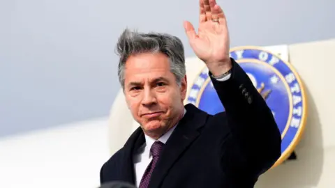 Getty Images Antony Blinken stepping off a plane