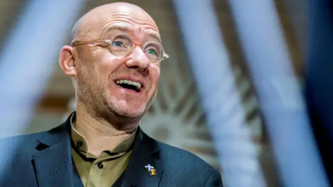 PA Media Patrick Harvie