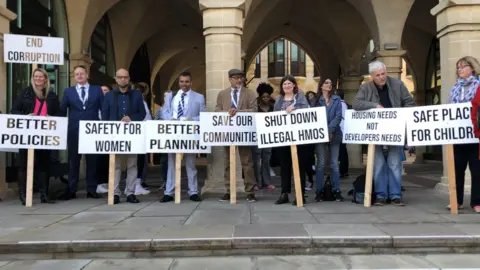 Martin Heath/BBC Protesters outside Northampton's Guildhall
