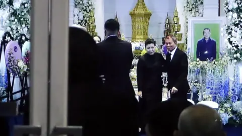 EPA Aimon Srivaddhanaprabha at her husband's funeral