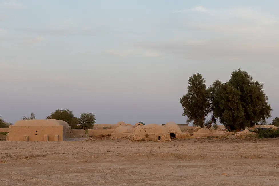 BBC The family lives in a small village made up of traditional mud dwellings, in a village on the banks of the Khash river. Image: Julian Busch/BBC