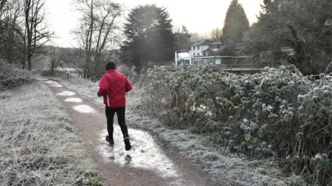 PA A jogger running by the River Avon in Bristol, pic 31 Jan