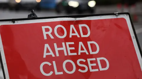 A generic road closed sign