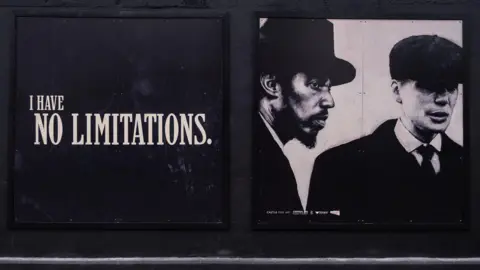 Castle Fine Art A black and white mural with the words "I have no limitations" in bold white lettering, next to Thomas Shelby and Jeremiah.