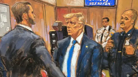 New York courtroom sketch of Donald Trump with son Eric Trump