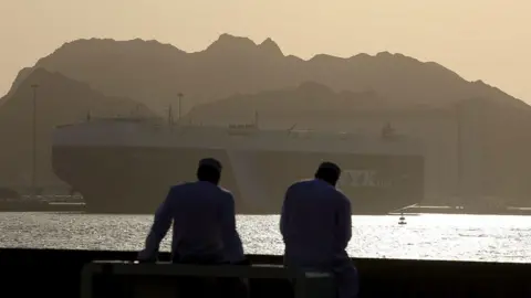 Ships wait in the Gulf of Oman as the Strait of Hormuz has continued to block traffic 