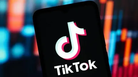 The logo of TikTok against a black background