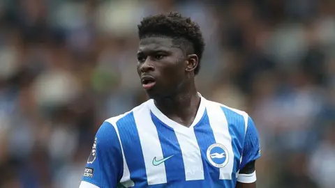 Carlos Baleba in action for Brighton against Tottenham in September 2025