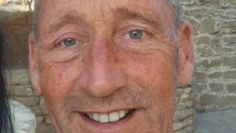 North Yorkshire Police Family handout of Peter. He is tanned and is smiling for the camera. He has blue eyes and short, whiskery hair and sideburns.