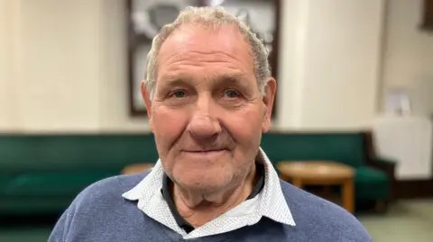 Fred Webster, who is in his 80s, sitting in the Pinxton Miners Welfare. 