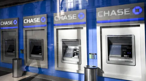 Getty Images Line of Chase bank ATMs in a New York City brank.