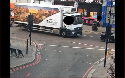 METROPOLITAN POLICE A large white Bidfood lorry is seen driving on a high street in CCTV images shared by the Met Police