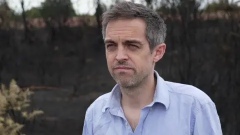 Dr Mark Hardiman speaks during a TV interview in the New Forest