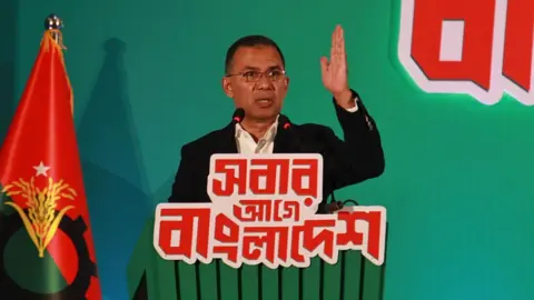 NurPhoto via Getty Images Bangladesh Nationalist Party (BNP) Chairperson Tarique Rahman unveils the party's election manifesto, outlining nine key pledges, ahead of Bangladesh's 13th national parliamentary election in Dhaka, Bangladesh, on February 6, 2026. (Photo by MD Abu Sufian Jewel/NurPhoto via Getty Images)