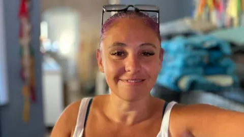 Kelly Saunby looking at the camera. 