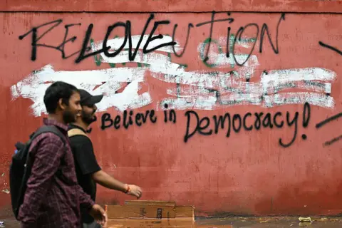 AFP via Getty Images Cockroach Janta Party (CJP) supporters arrive at Jantar Mantar in Delhi.