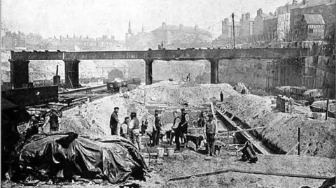 SWA Newton Archive shot of workmen digging out the cutting for the station