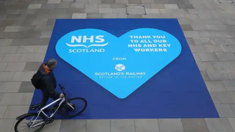 PA Media NHS heart sign