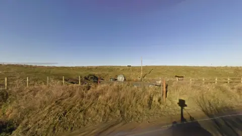 Google Street View The entrance to the Arnolds Field site at Launder's Lane in 2008, with fewer fences.