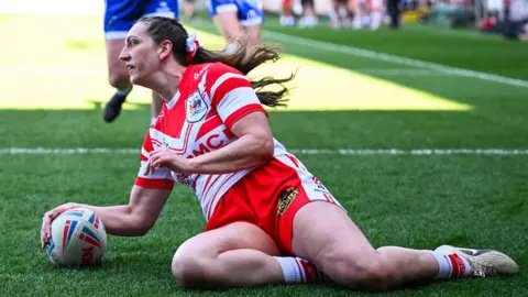Rachael Woosey dotting down to score a try for St Helens.