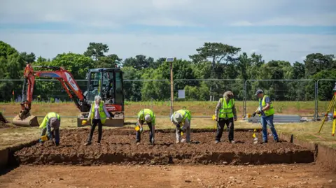 James Dobson/National Trust People working on an archaeological dig at Sutton Hoo, Suffolk