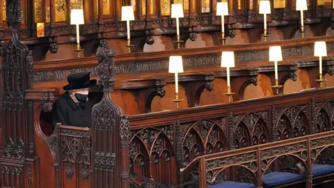 PA Media The Queen sitting alone at the funeral of the Duke of Edinburgh