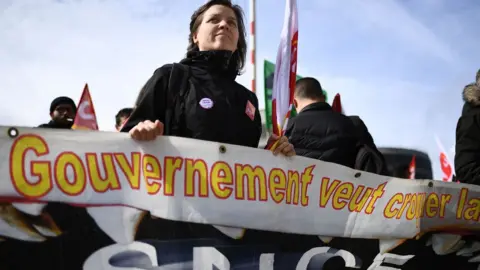 Getty Images Rail worker demonstrating in Marseille on 18 April