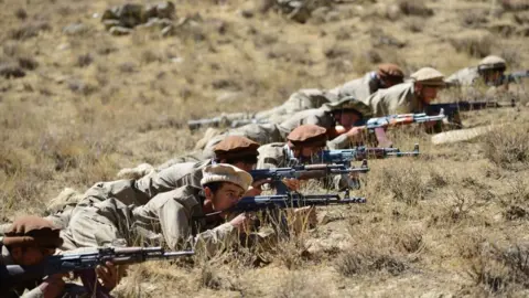 Getty Images Afghan resistance movement and anti-Taliban uprising forces take part in a military training in Panjshir province on 2 September