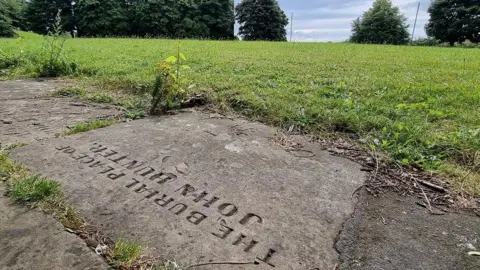 Dr Myra Giesen A path with the engraving 'The Burial Place of John Hunter'.