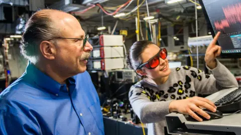David Awschalom (wearing blue shirt) is the Liew Family Professor of Molecular Engineering and Physics at the University of Chicago's Pritzker School of Molecular Engineering