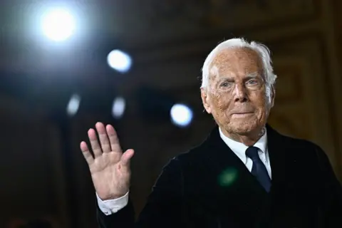 Getty Images Giorgio Armani waving