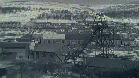 A black and white image of a former mining community 