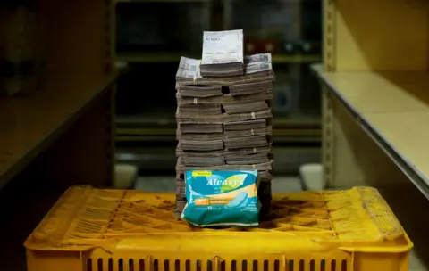 Reuters A packet of sanitary pads next to 3,500,000 bolivars