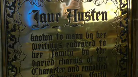 A close up of Jane Austen's gravestone at Winchester Cathedral.