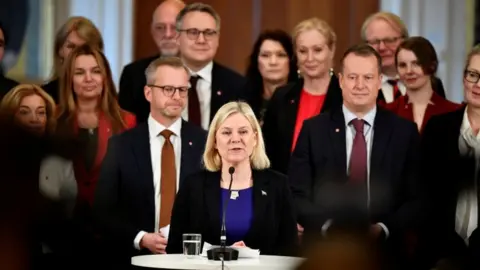 TT/Reuters Prime Minister Magdalena Andersson presents her team of new ministers during a news conference after the government declaration in the Swedish parliament Riksdagen, in Stockholm, Sweden November 30, 2021