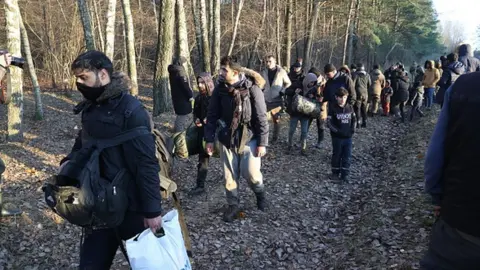 Getty Images Migrants at the Polish-Belarusian border