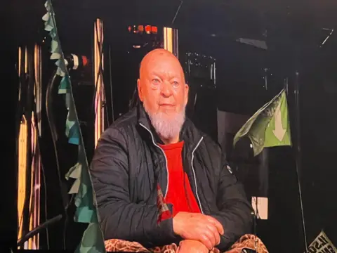 Sir Michael Eavis watching Coldplay from the Pyramid stage.