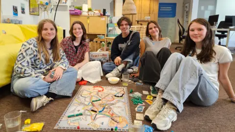BBC Friends in Belgium playing a board game