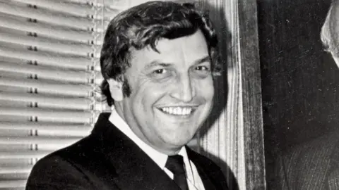 Family handout Black and white photo of Eric Moody looking into the camera