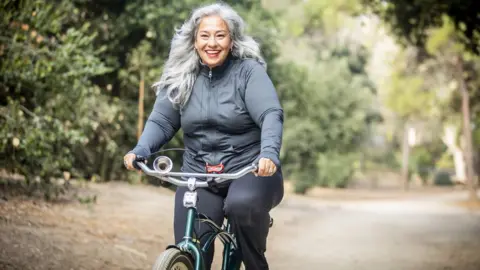 Getty Images A woman on a bike