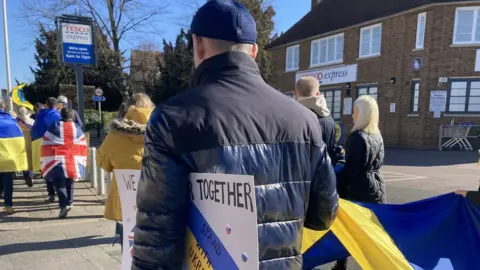 Jenny Kirk/BBC People marching in Peterborough against the Ukrainian conflict
