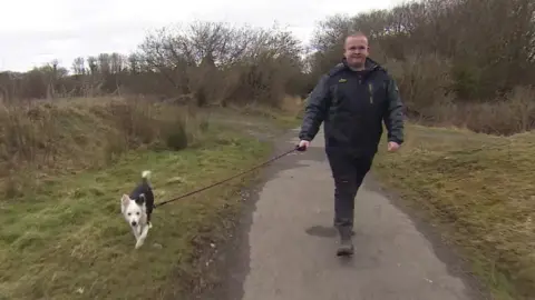 James Cosens and his dog Rosie at Morfa Berwig Nature Reserve