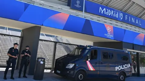 AFP Spanish police officers stand guard outside the Wanda Metropolitan Stadium in Madrid