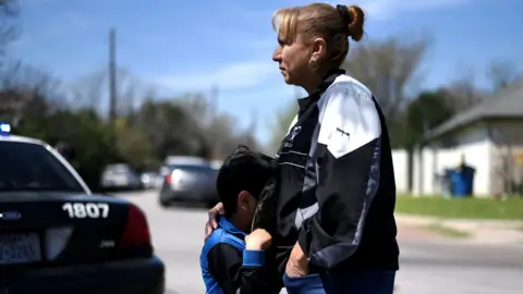 Reuters Neighbours outside the explosion