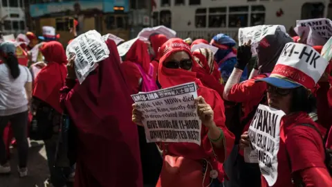 AFP / Getty Indonesian migrant workers attend a May Day rally, also known as Labour Day, in Hong Kong on May 1, 2018.