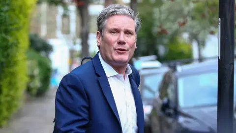 Getty Images Sir Keir Starmer leaving his home on Saturday