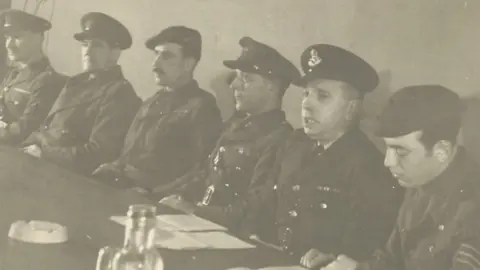 Kim Brook Walter Brook (fourth from left) chairing an anti-Nazi tribunal