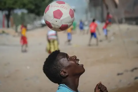 AFP A Somali child plays football on the Lido beach in Mogadishu, on January 12, 2018.